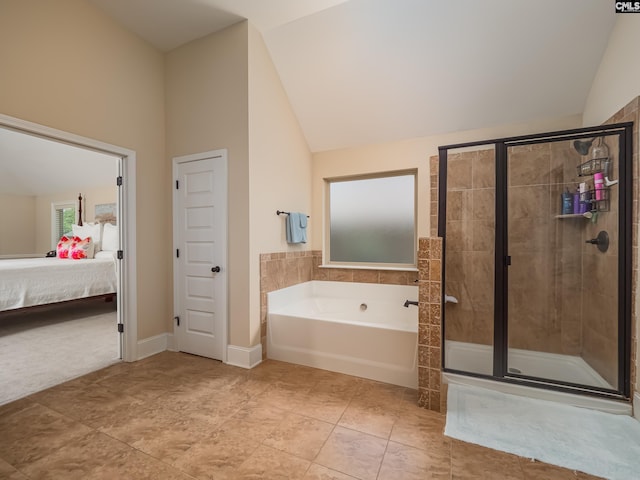 bathroom featuring independent shower and bath, tile patterned floors, and high vaulted ceiling