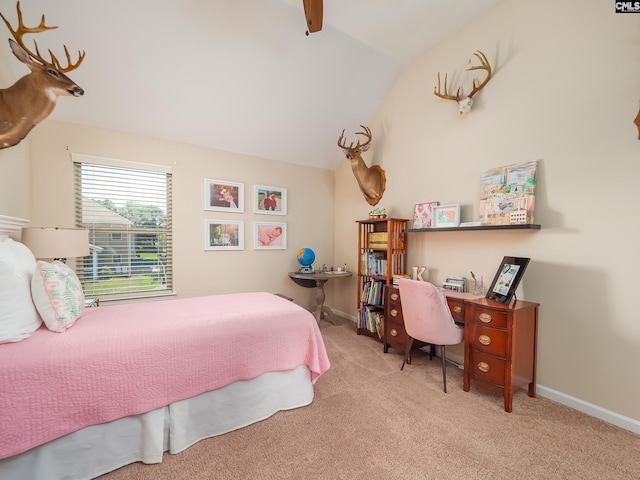 bedroom with light carpet and vaulted ceiling