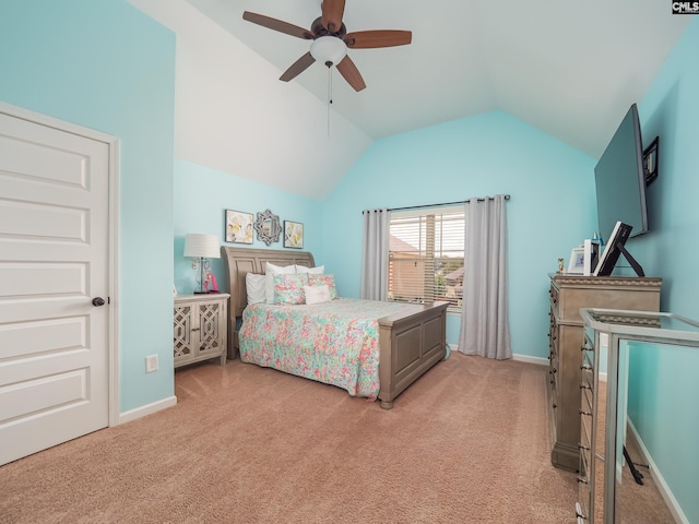 carpeted bedroom featuring ceiling fan and vaulted ceiling