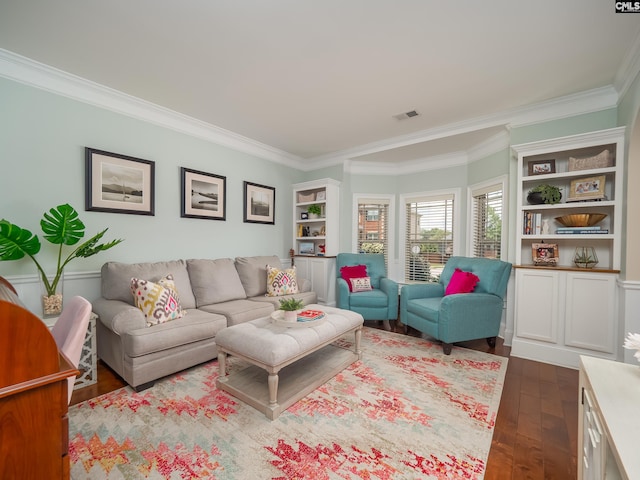 living room featuring dark hardwood / wood-style flooring and crown molding