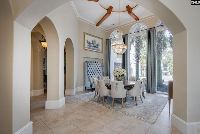 tiled dining room featuring a chandelier