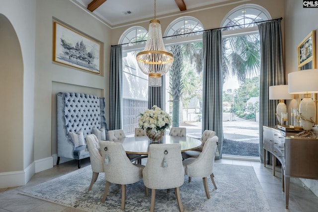 dining area with an inviting chandelier, ornamental molding, and beam ceiling