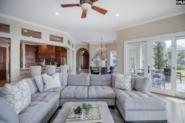 tiled living room with ornamental molding and ceiling fan with notable chandelier