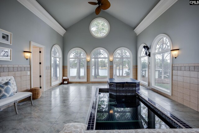 1118 Marble Arch Ct, Chapin, SC 29036 - bathroom featuring a water view, tile walls, ceiling fan, high vaulted ceiling, and healthy amount of natural light