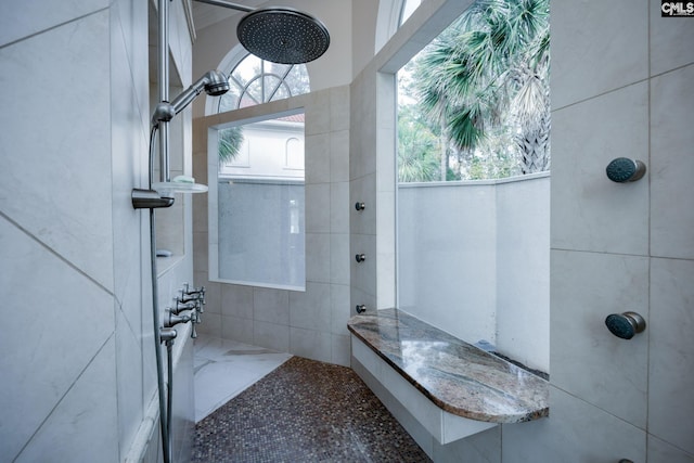 bathroom with tiled shower