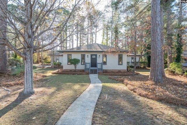 ranch-style house with a front lawn