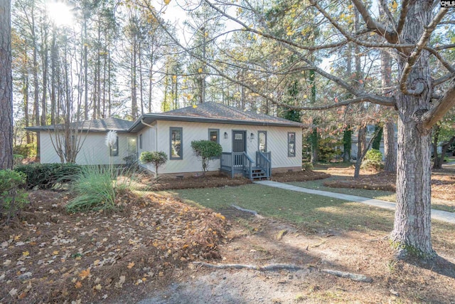 ranch-style home with a front lawn