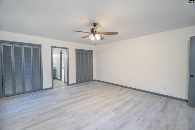 unfurnished bedroom featuring ensuite bathroom, ceiling fan, and light wood-type flooring