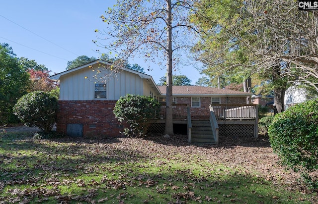 back of property featuring a deck