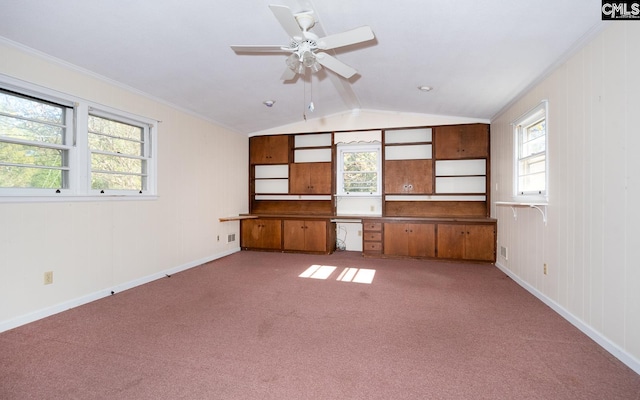 unfurnished living room with vaulted ceiling, light colored carpet, ceiling fan, and crown molding