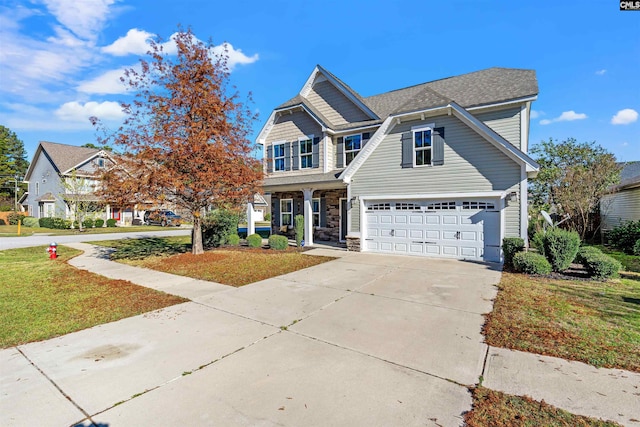 view of front of house with a garage and a front lawn