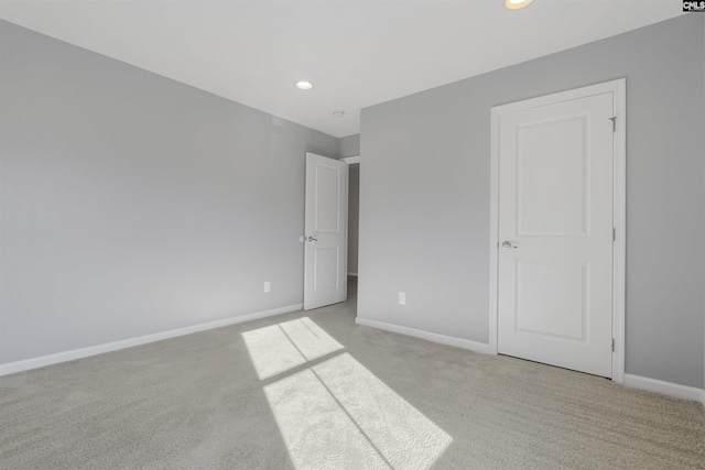 unfurnished bedroom with light carpet