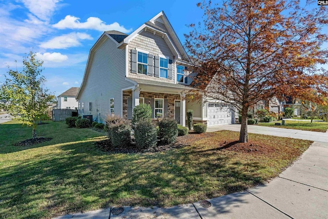 view of front of property featuring a front yard and a garage