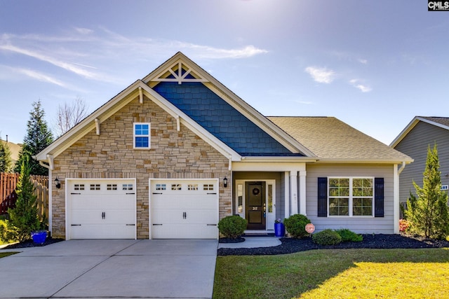 craftsman-style home with a front lawn and a garage