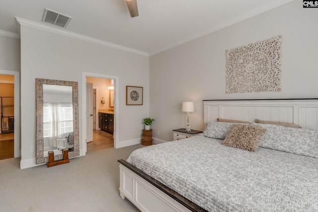 carpeted bedroom featuring connected bathroom, ceiling fan, and crown molding