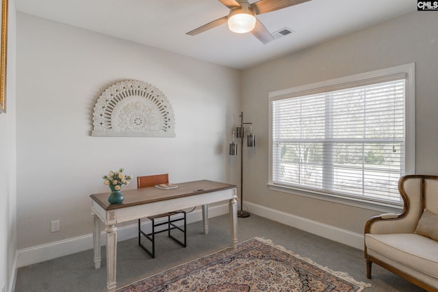 office space with ceiling fan and carpet