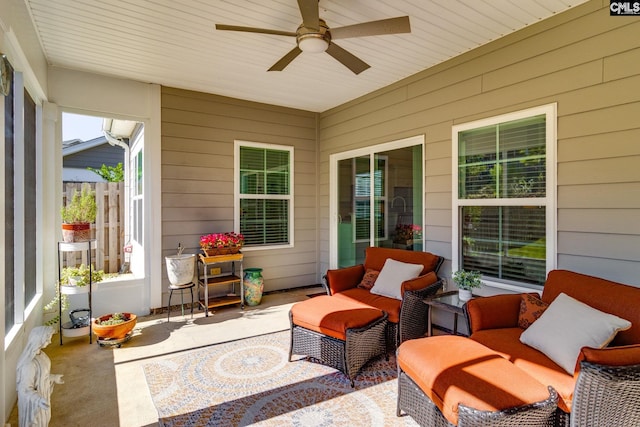 sunroom featuring ceiling fan