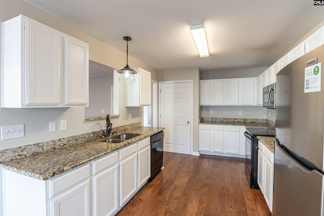 kitchen featuring white cabinets, sink, black appliances, decorative light fixtures, and dark hardwood / wood-style floors