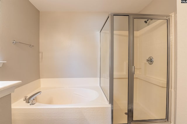 bathroom with separate shower and tub