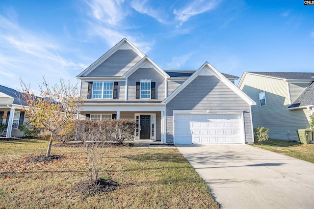 view of front of house with a front yard and a garage