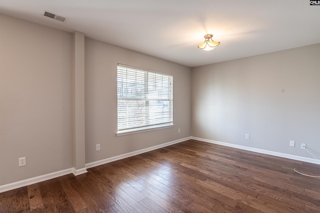 empty room featuring dark hardwood / wood-style floors