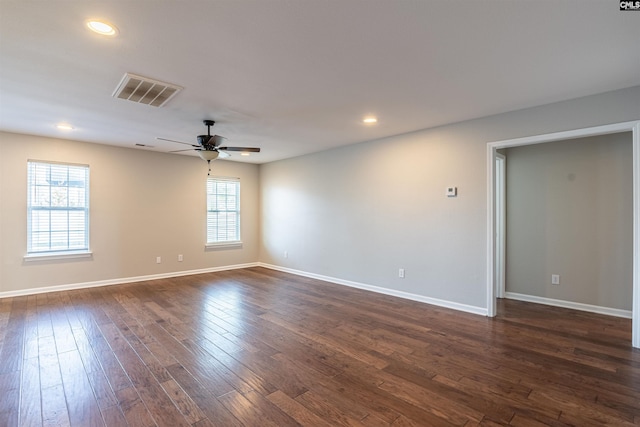 unfurnished room featuring dark hardwood / wood-style flooring and ceiling fan