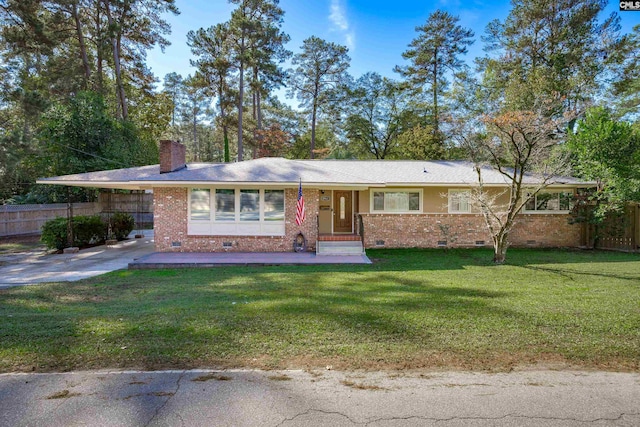 ranch-style house featuring a front yard and a carport