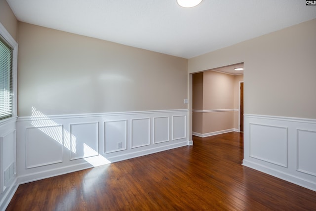 spare room featuring dark hardwood / wood-style floors