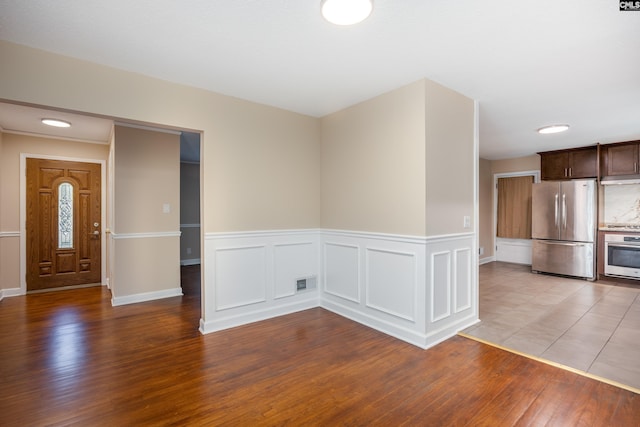 unfurnished dining area featuring light hardwood / wood-style flooring