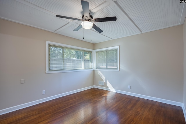 spare room featuring ceiling fan and dark hardwood / wood-style flooring