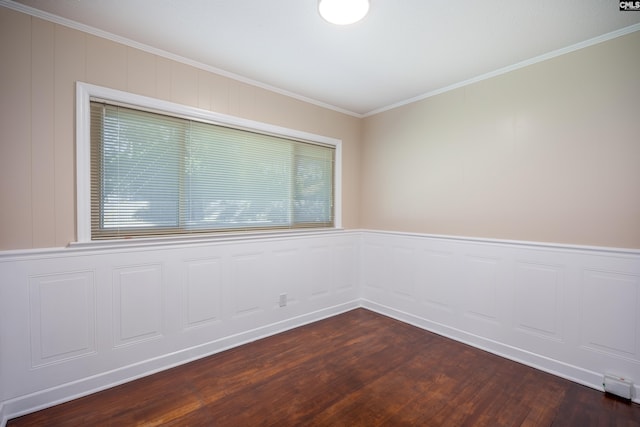 spare room with crown molding, dark hardwood / wood-style flooring, and plenty of natural light