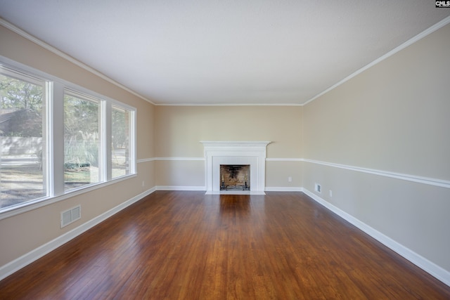 unfurnished living room with ornamental molding and dark wood-type flooring