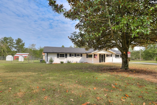 ranch-style home with a front lawn