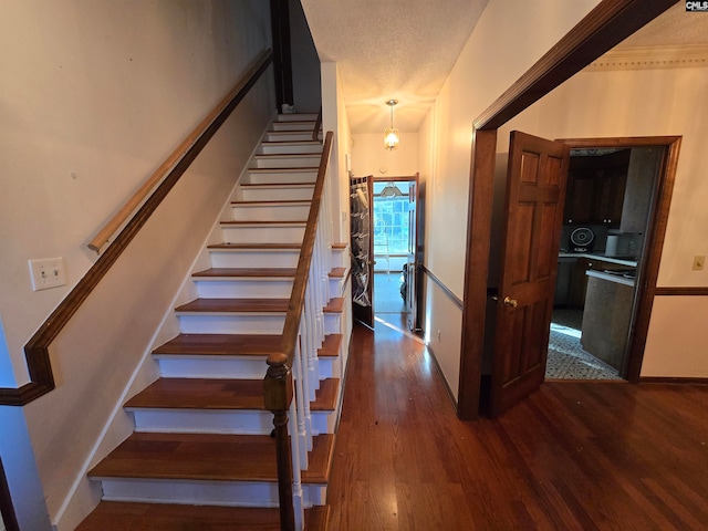 staircase featuring hardwood / wood-style floors