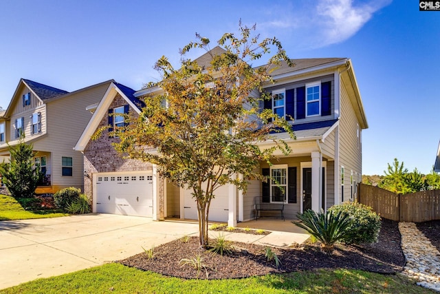 craftsman inspired home featuring a porch and a garage