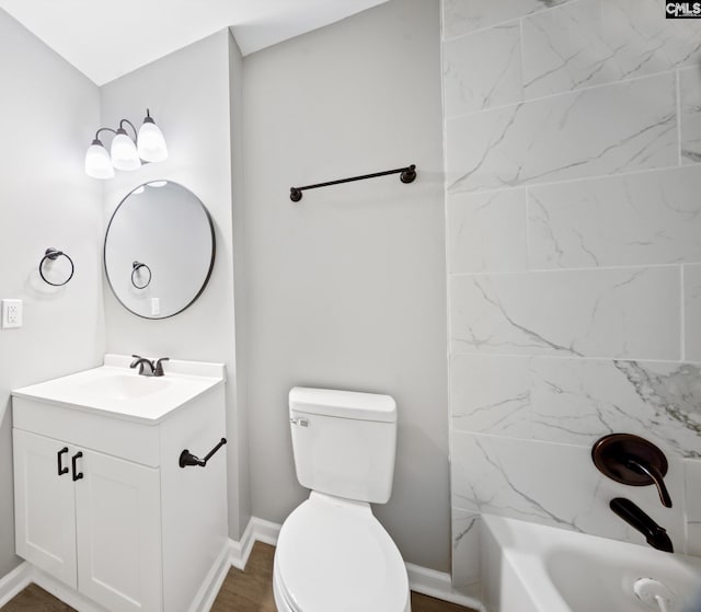 full bathroom featuring vanity, toilet, and tiled shower / bath combo