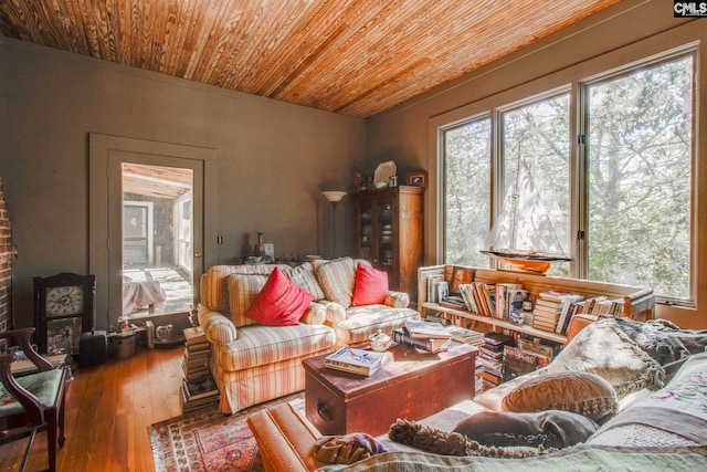 living room featuring hardwood / wood-style floors and wooden ceiling