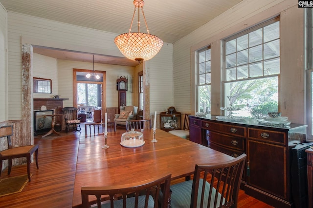 dining room with a notable chandelier and wood-type flooring