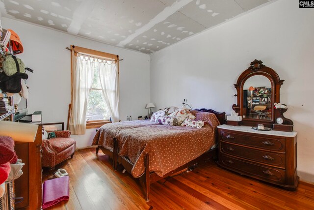 bedroom with light hardwood / wood-style flooring