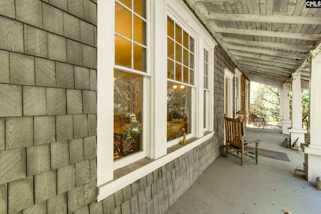 view of side of property with a porch