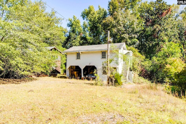 view of outbuilding with a carport