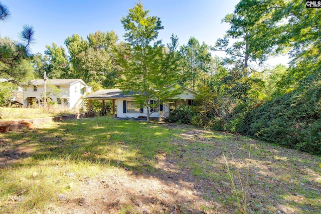 view of yard with covered porch