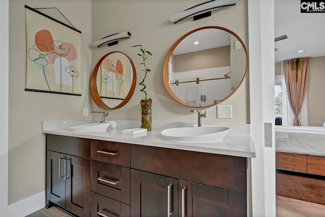 bathroom featuring vanity and wood-type flooring