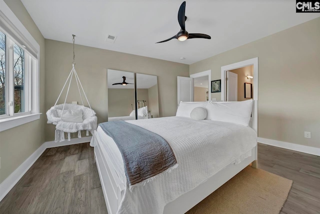 bedroom with wood-type flooring and ceiling fan