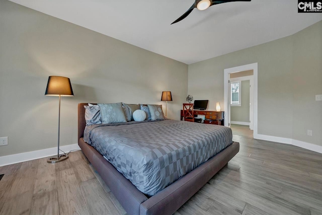 bedroom featuring hardwood / wood-style flooring and ceiling fan