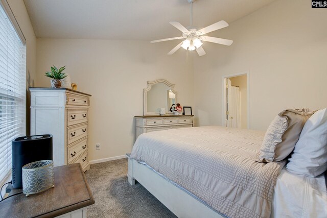 carpeted bedroom featuring ceiling fan and lofted ceiling