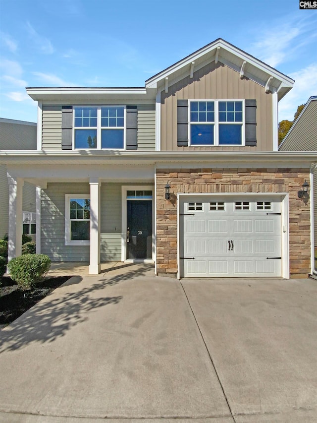 view of front of home with a porch and a garage