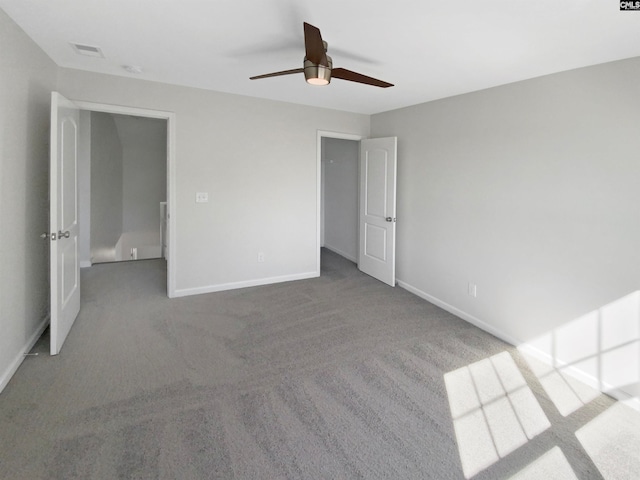 unfurnished bedroom featuring ceiling fan and light carpet