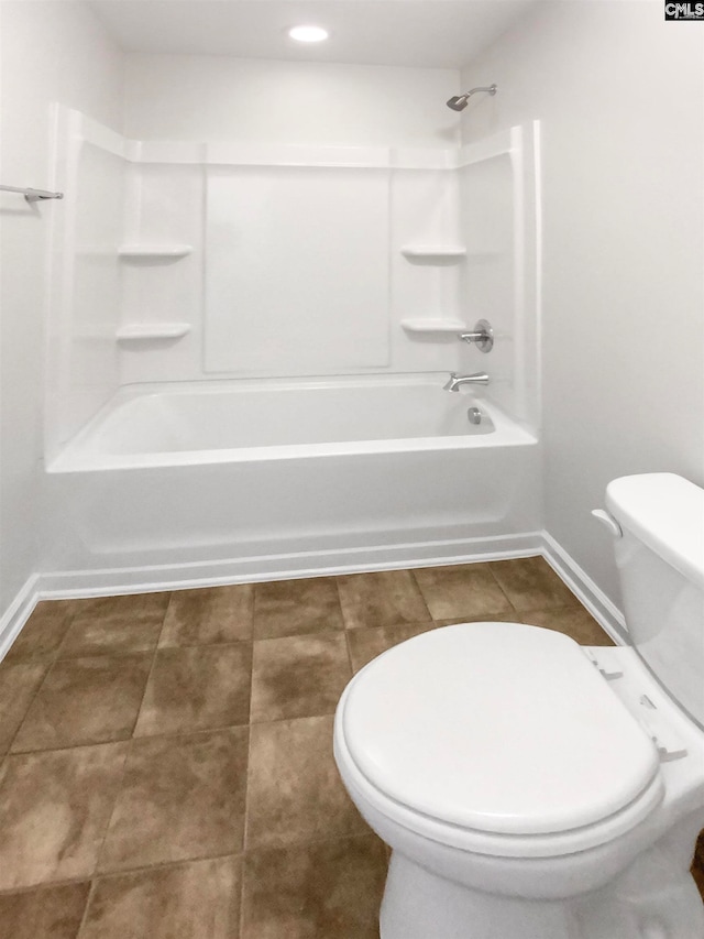 bathroom featuring tile patterned floors,  shower combination, and toilet