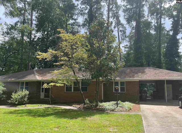 4650 Crystal Dr, Columbia, SC 29206 - ranch-style house featuring a front yard, driveway, brick siding, and an attached carport